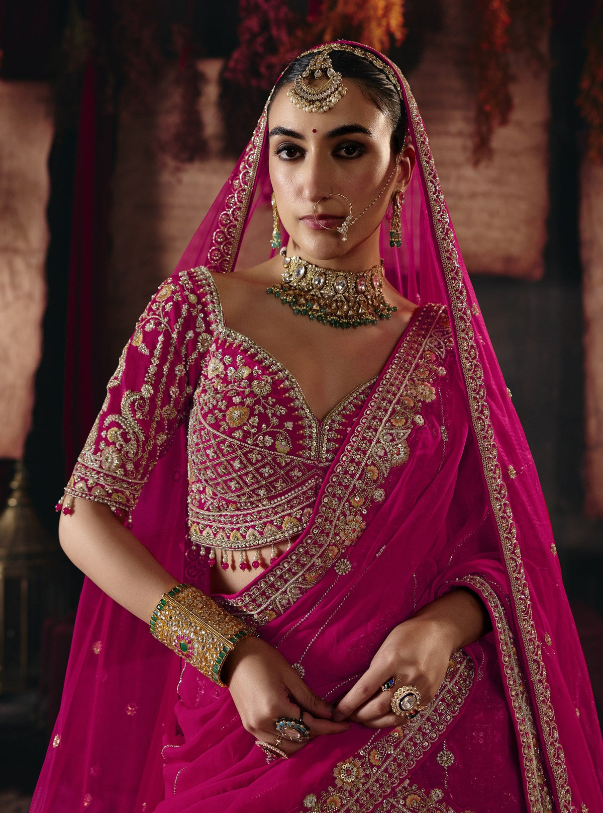 Magenta pink bridal lehenga, embroidered blouse and dupatta detail