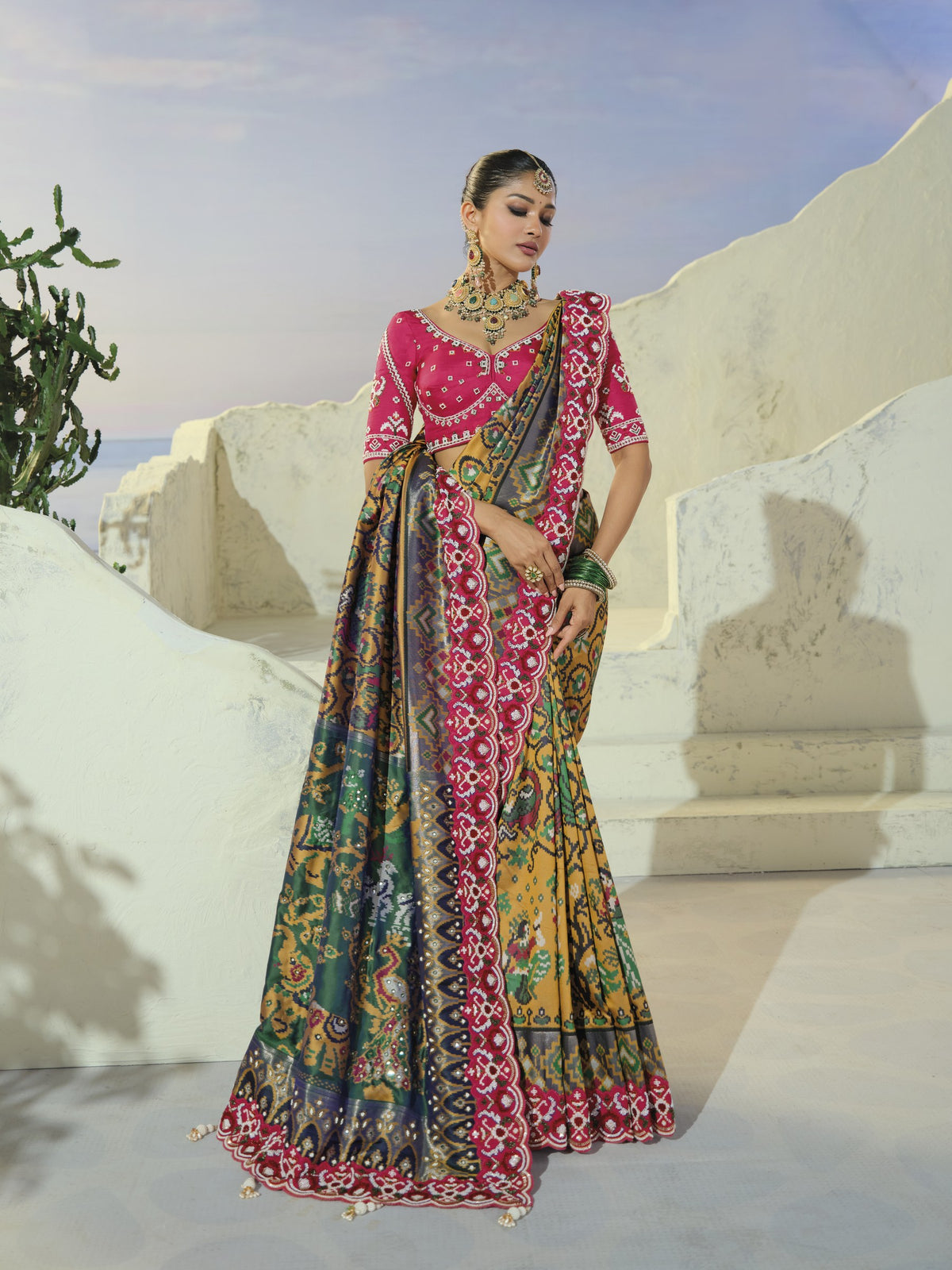 Mustard and teal patola saree, draped front view