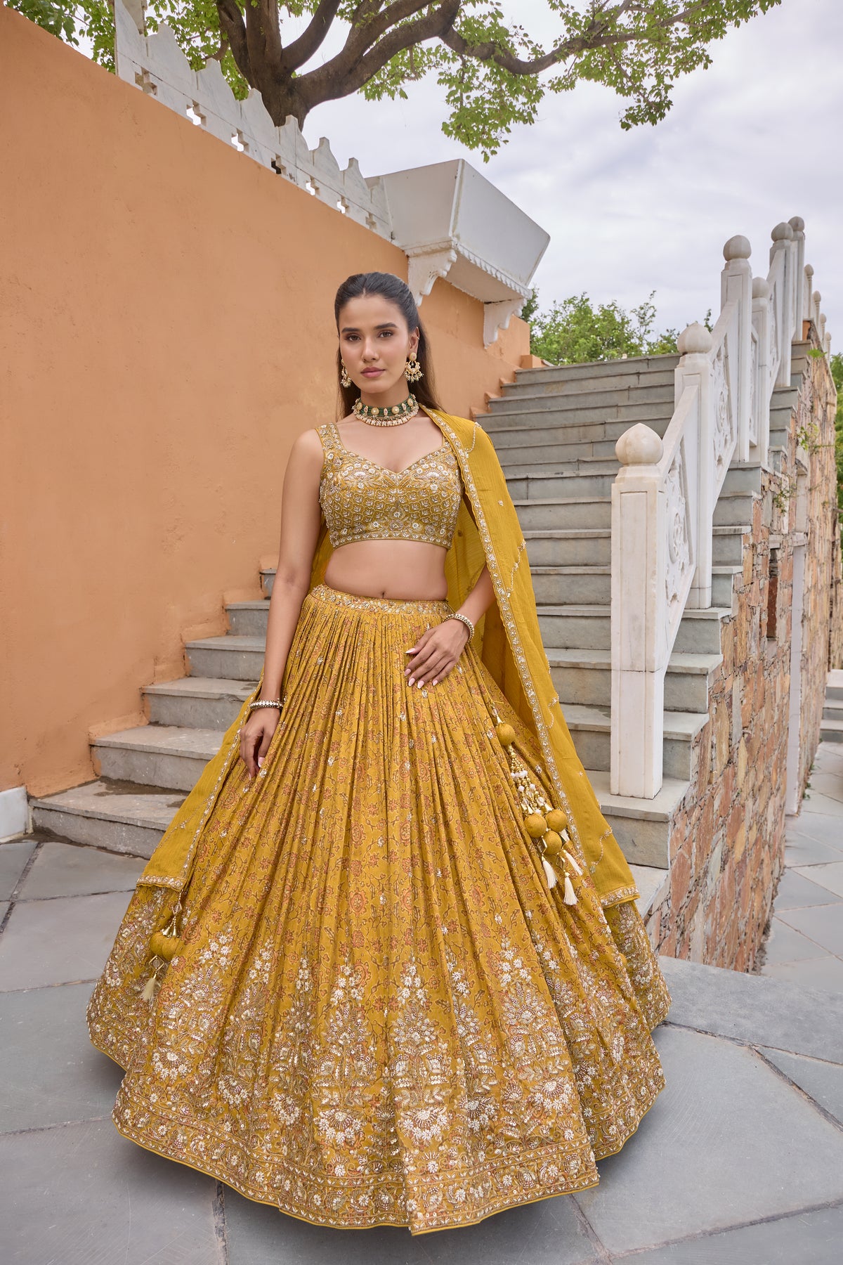 Preksha lehenga with mustard dupatta over the shoulder