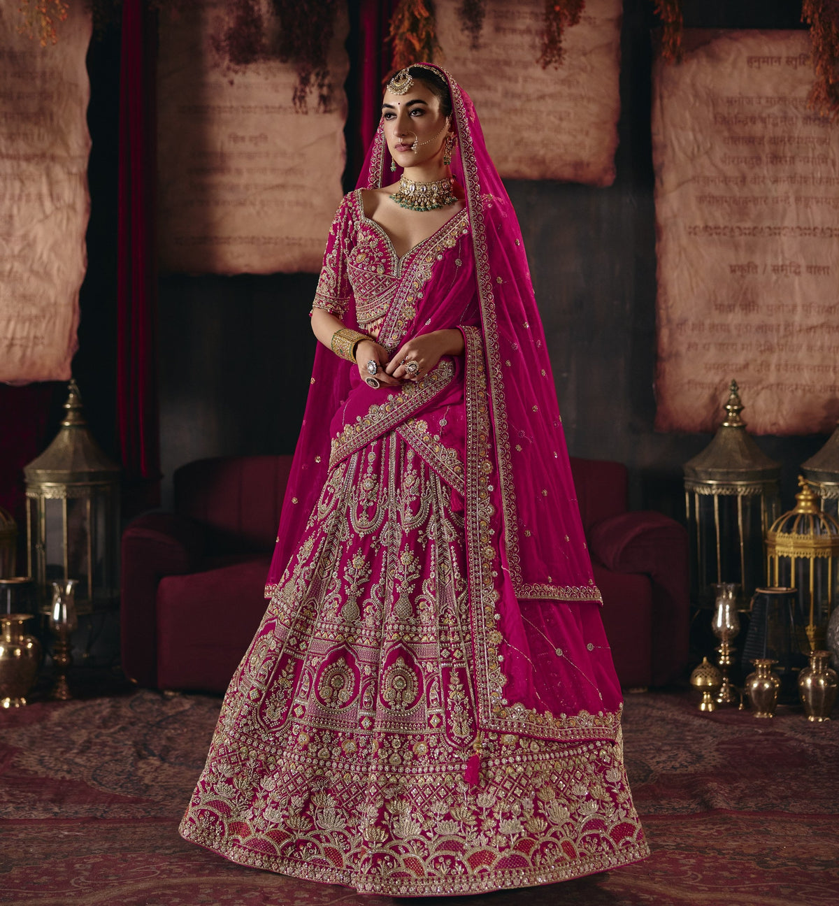 Magenta pink and gold embroidered bridal lehenga set, full length