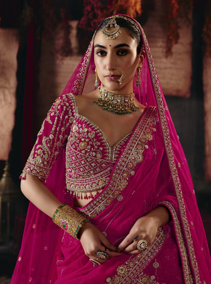 Magenta pink bridal lehenga, embroidered blouse and dupatta detail