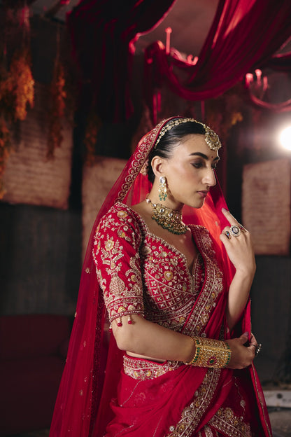 Crimson red bridal lehenga, tasselled sleeve detail