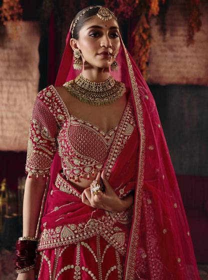 Cherry red bridal lehenga, embroidered blouse close-up