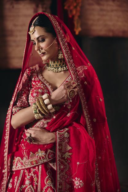 Red palace and peacock bridal lehenga, close-up