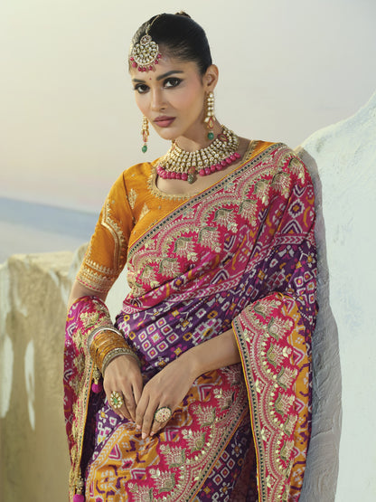 Purple and rani pink patola saree, embroidered border close-up