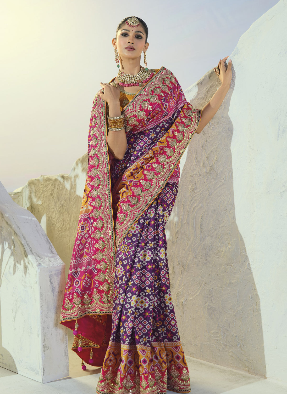 Purple and rani pink patola saree, draped view