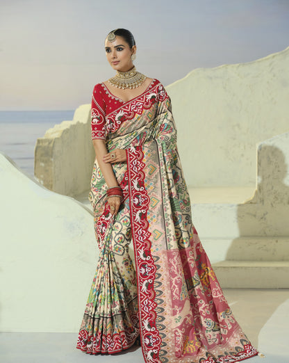 Cream patola saree with red border, full length