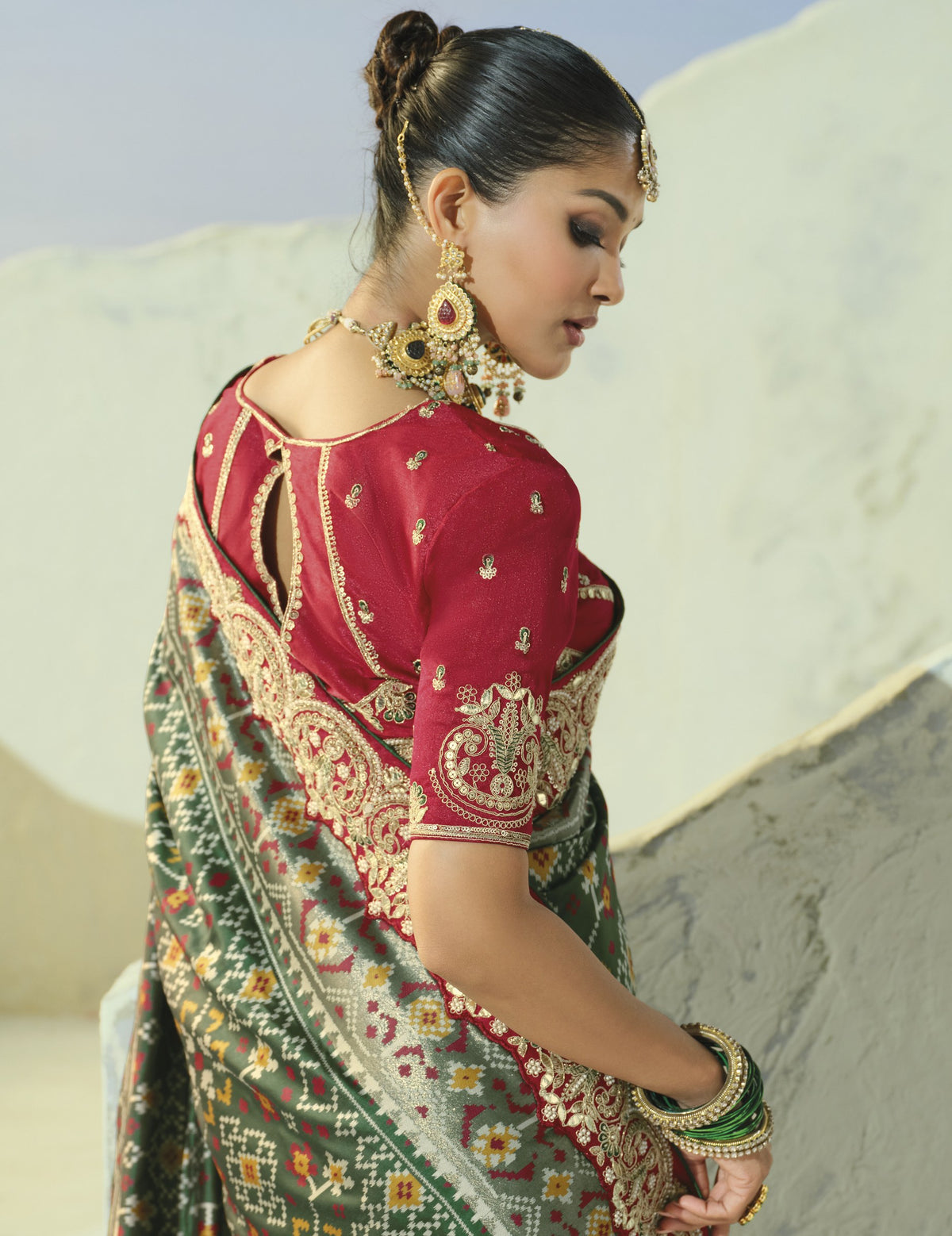 Bottle green patola saree, back view of blouse
